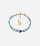 Bracelet Zag Tondela bleu en acier doré et tissu avec oeil protecteur