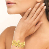 Bracelet Jonc fleurs en acier doré 840j-1020