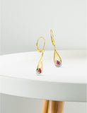 Boucles d'oreilles en or jaune 18ct, or blanc et rubis 382-180